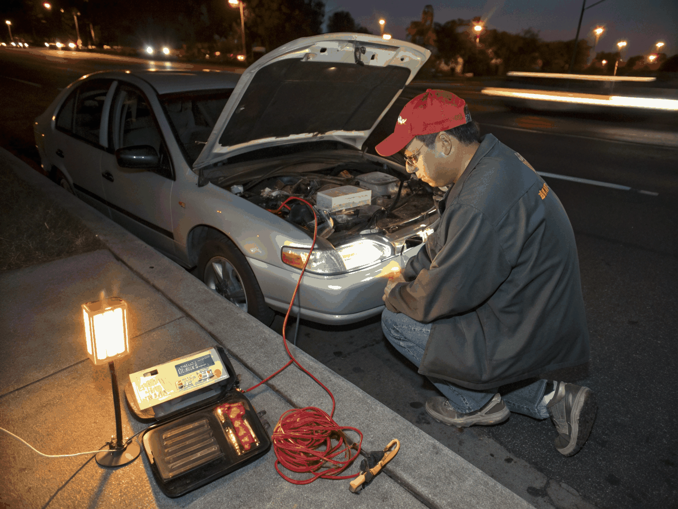 Electrician answering dispatch call inside service truck